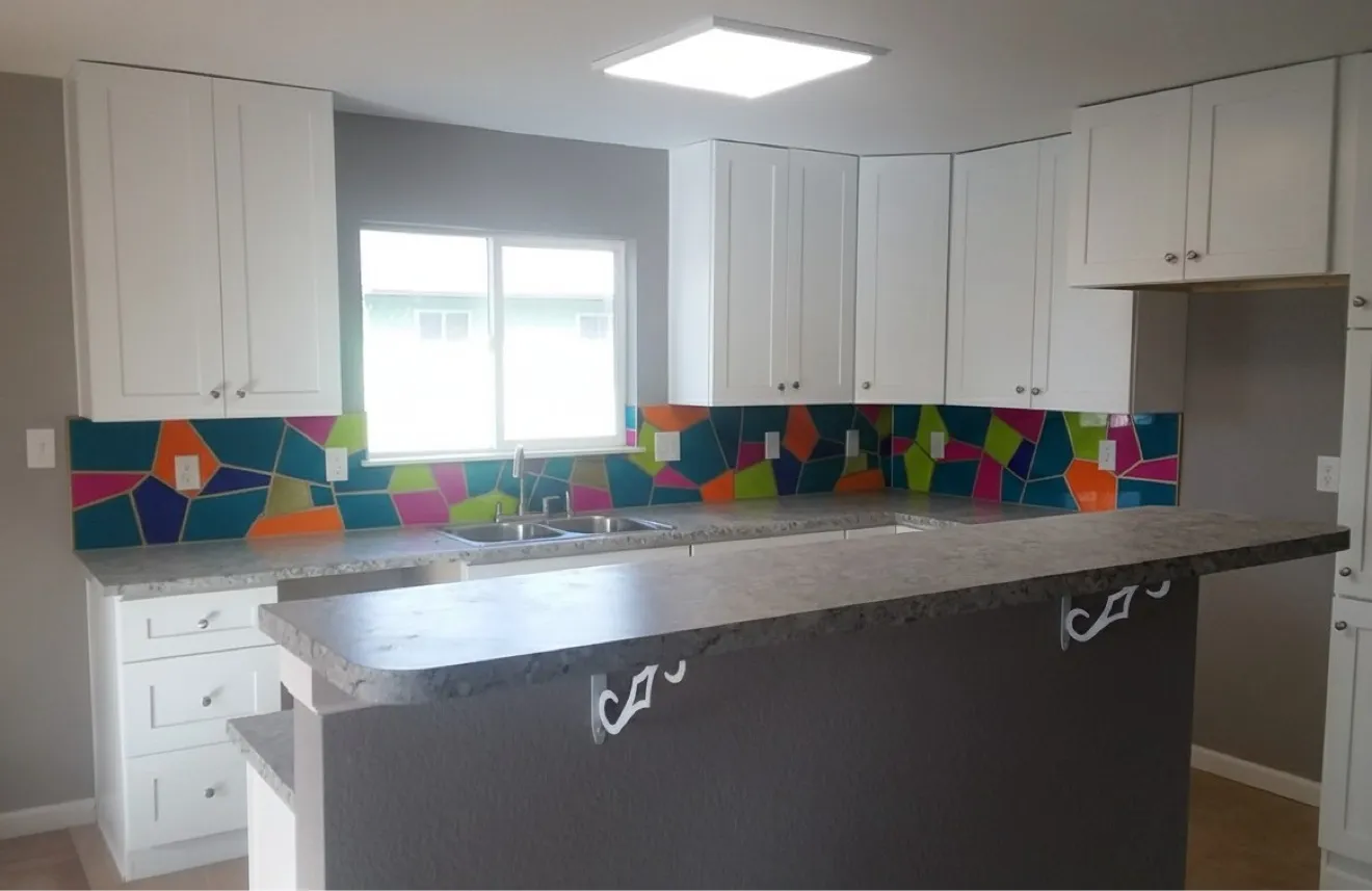 Colourful geometric hand-cut glass mosaic backsplash
